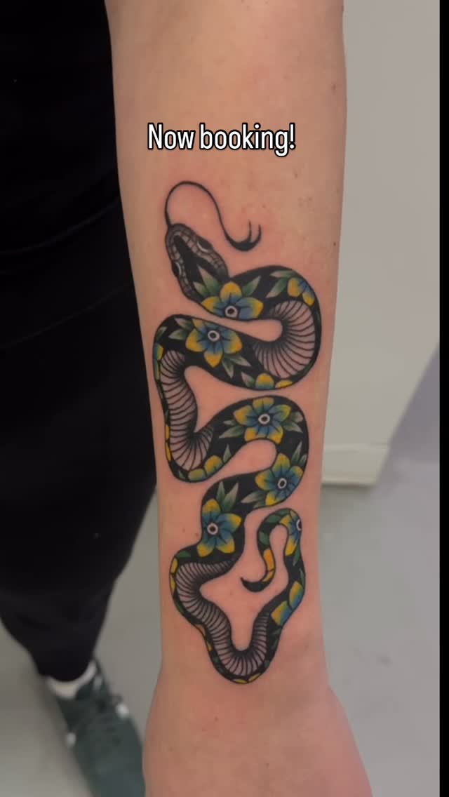 Color illustrative serpent forearm tattoo